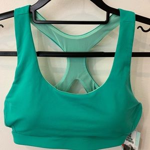 Teal DSG sports bra, never worn and still has tag